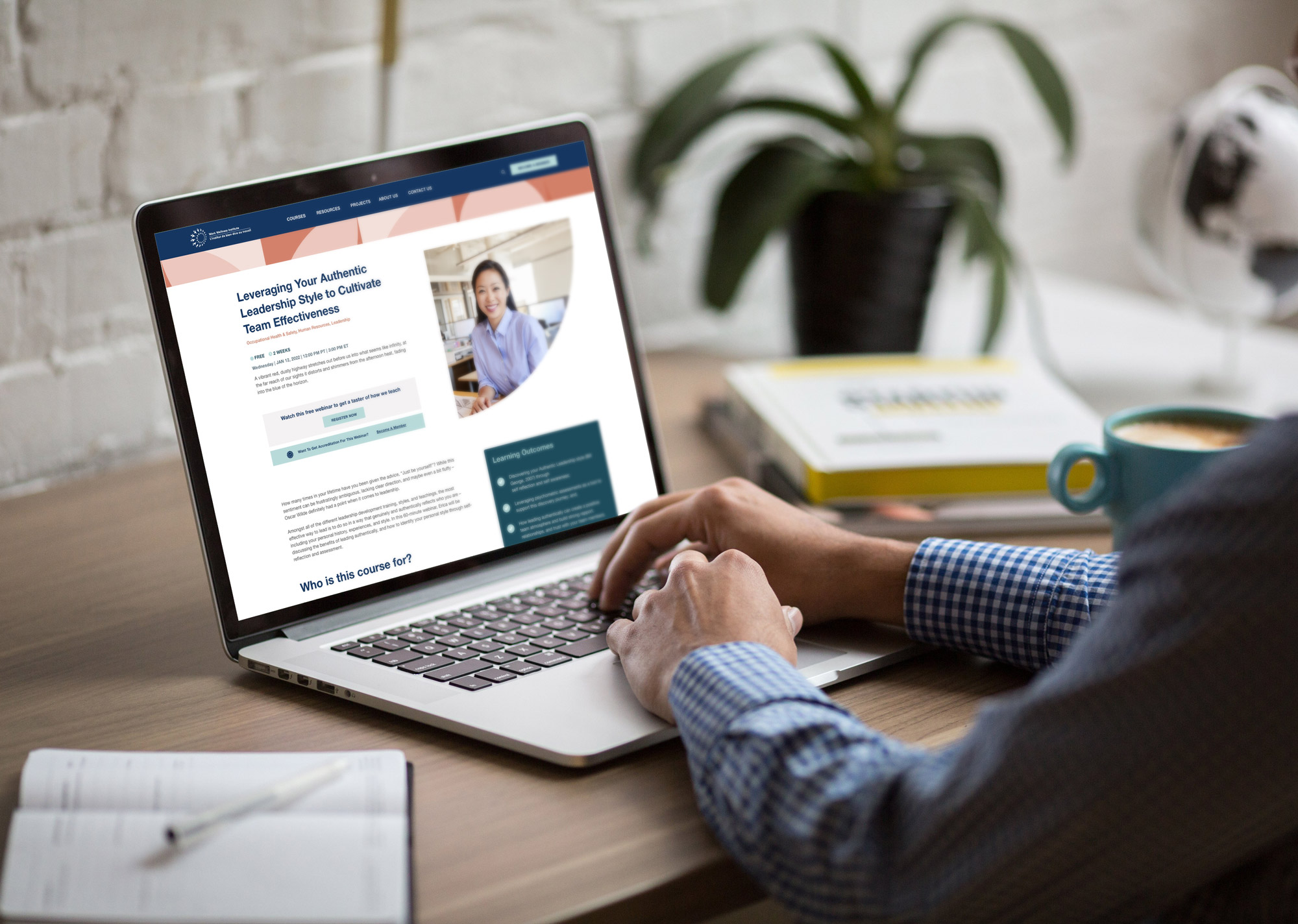 A man on his laptop viewing a Work Wellness Institute course