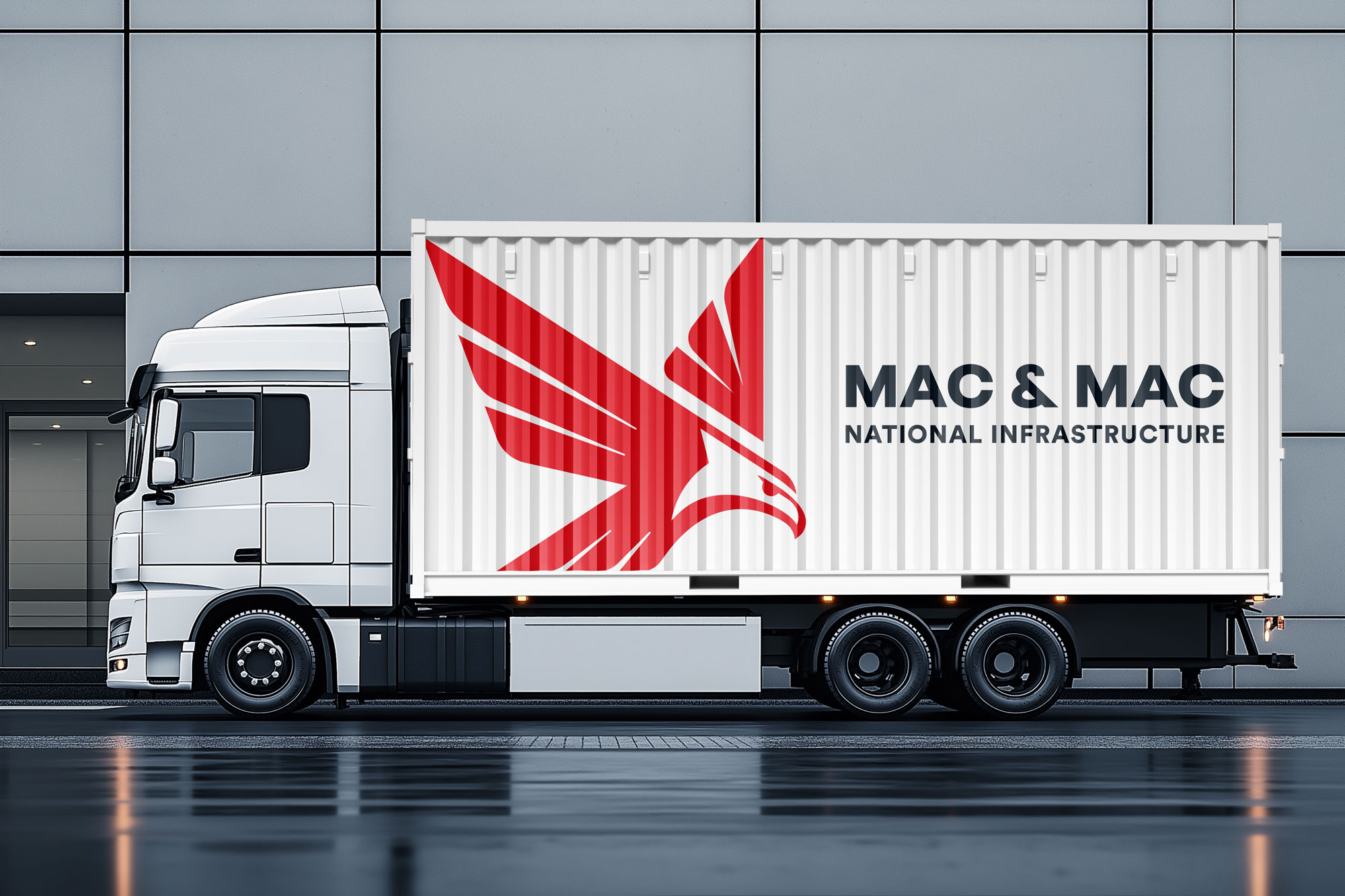 White transport truck with the Mac & Mac National Infrastructure logo and red eagle mark on the trailer